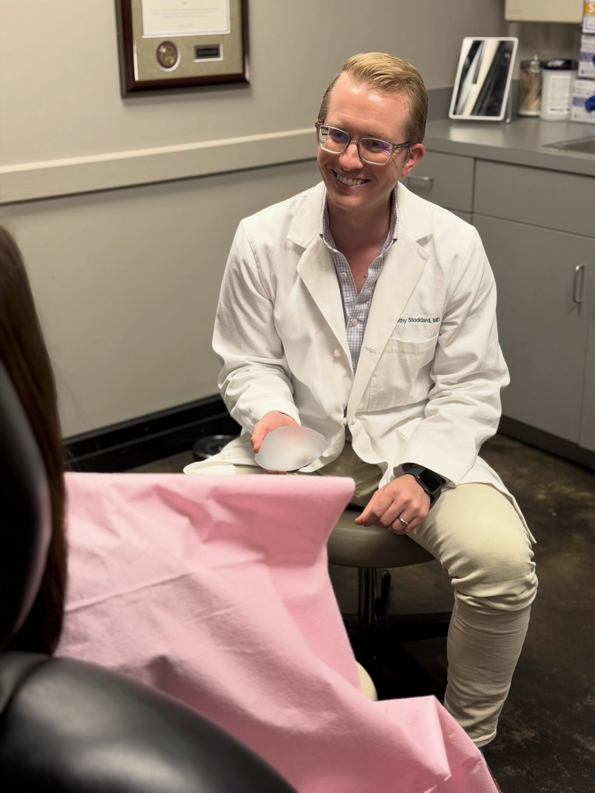 Dr. Timothy Stoddard speaking with a patient during a consultation