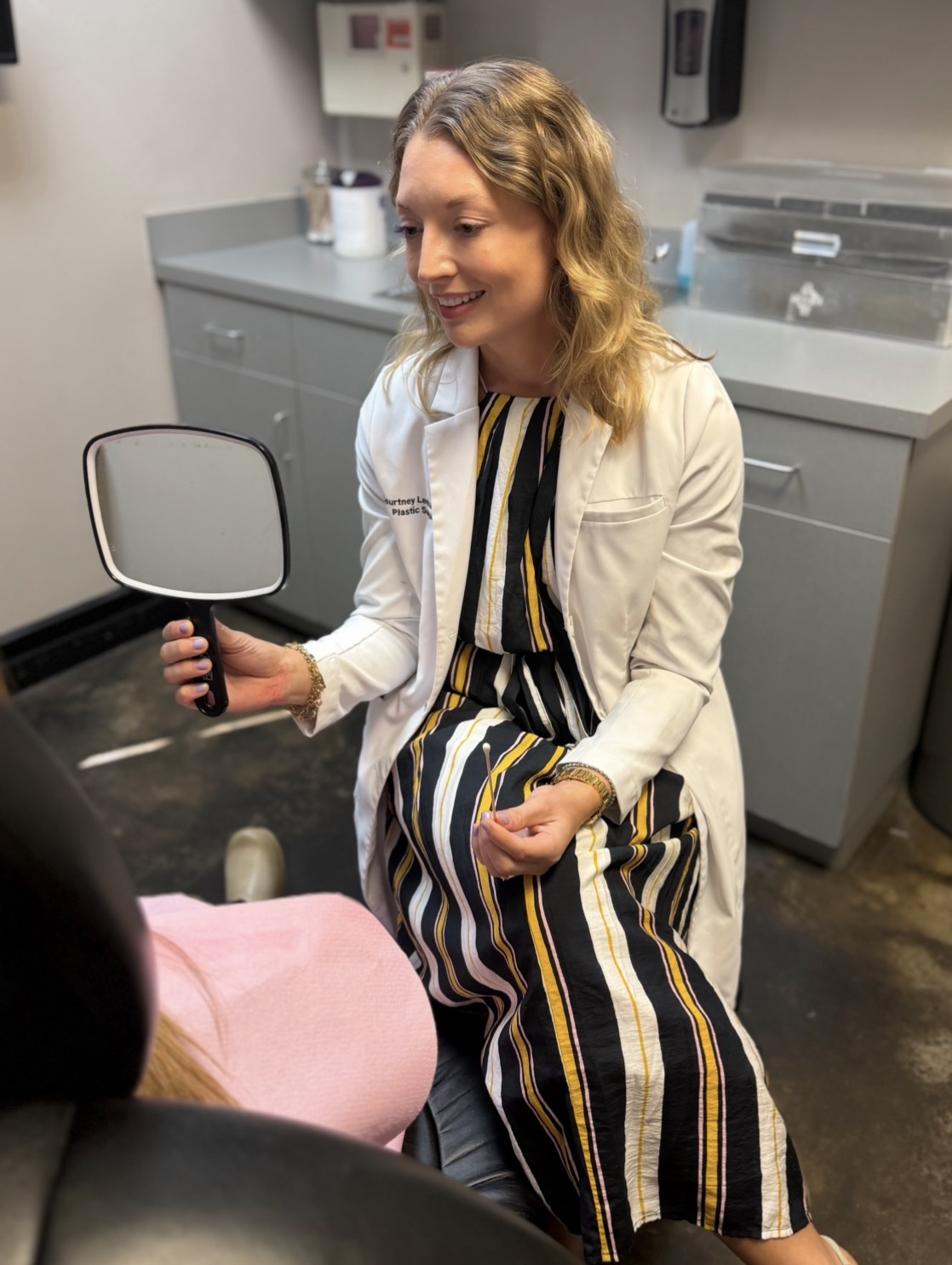 Dr. Courtney Leonard speaking with a patient during a consultation